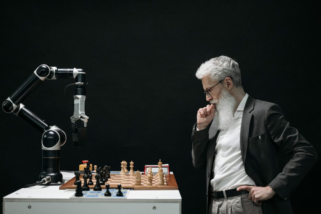 elderly man thinking while looking at a chessboard